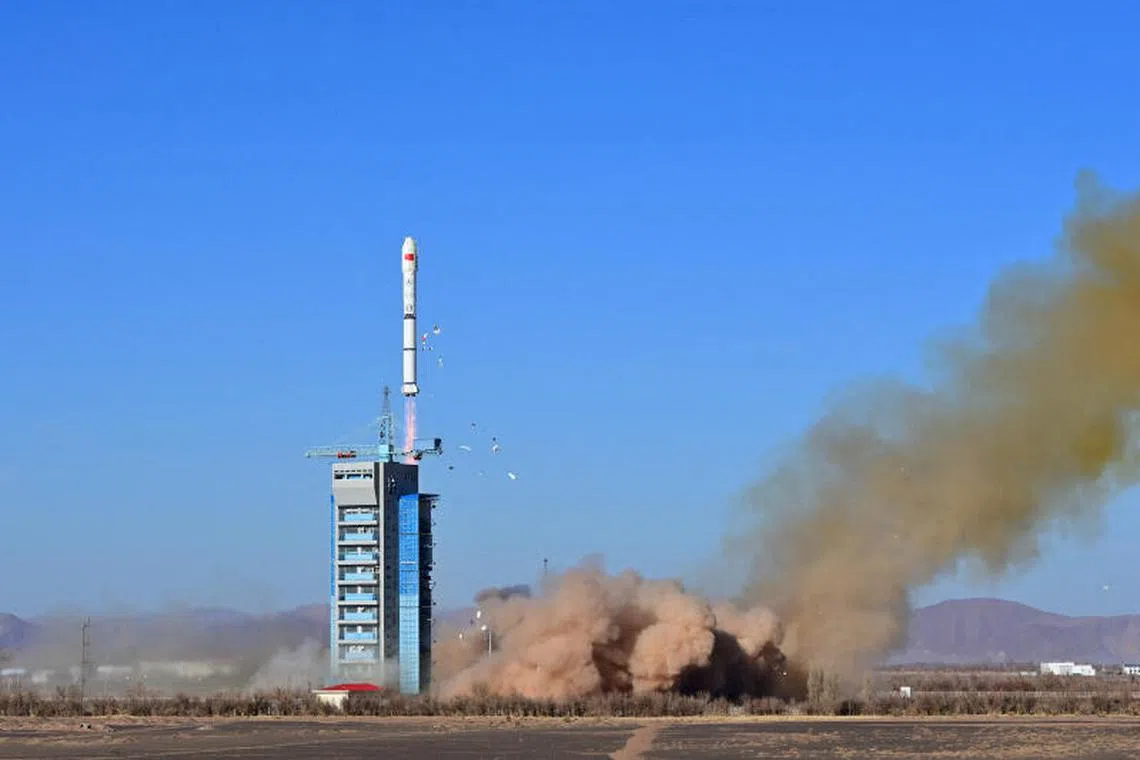 FILE PHOTO: A Long March-2C carrier rocket carrying satellite MISRSAT-2 takes off from the Jiuquan Satellite Launch Center in China, December 4, 2023. cnsphoto via REUTERS/File Photo