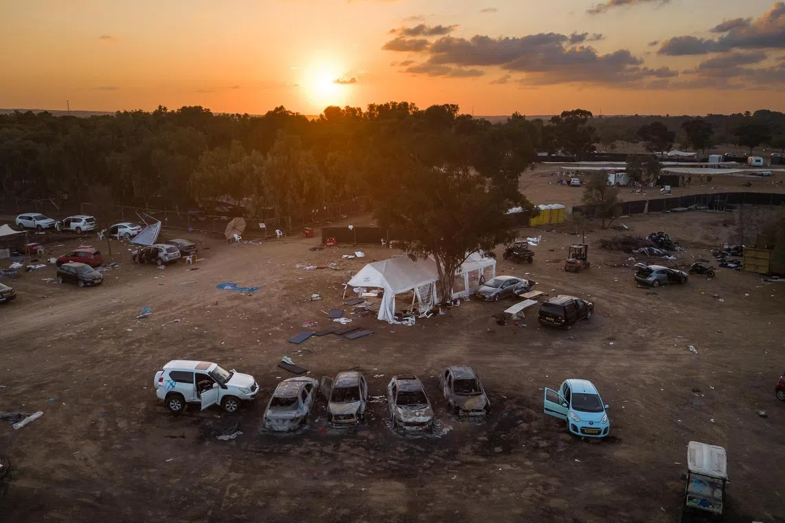 FILE —Abandoned and destroyed vehicles remain scattered at the site of the Nova music festival, where witnesses reported seeing rapes nearby after the Hamas-led attacks on Oct 7, 2023.