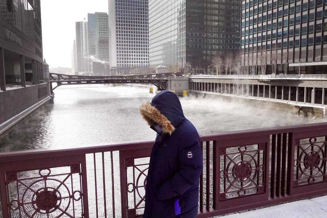 Vapor rises from the Chicago River as temperatures hover in the negative single-digits on December 23, 2022 in Chicago, Illinois. Sub-zero temperatures are expected to grip the city for the next couple of days with wind chill temperature dipping as low as -40 degrees. 