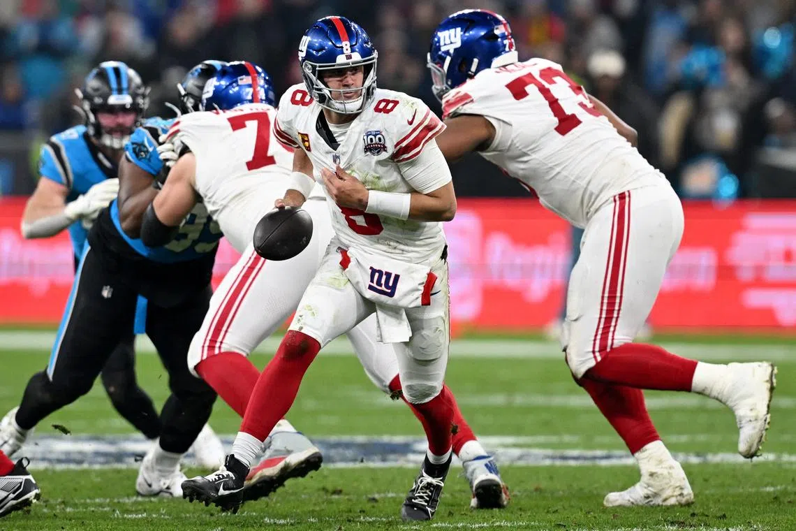 FILE PHOTO: American Football - NFL - Carolina Panthers v New York Giants - Allianz Arena, Munich, Germany - November 10, 2024 New York Giants' Daniel Jones in action REUTERS/Angelika Warmuth/File Photo