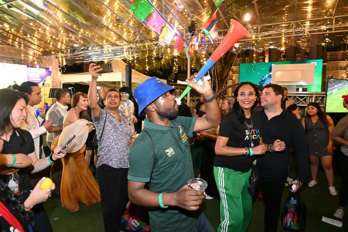 A South Africa fan blowing a vuvuzela during the pre-game party at the kick-off fiesta for the World Cup at CHIJMES on June 11.