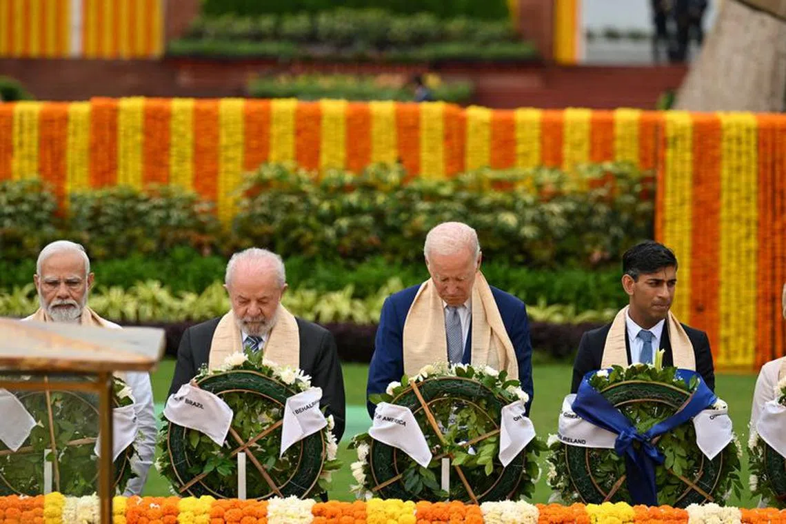 FILE PHOTO: Prime Minister of India Narendra Modi, Brazil President Luiz Inacio Lula da Silva, U.S. President Joe Biden and UK Prime Minister Rishi Sunak visit Raj Ghat memorial with other G20 leaders, Sept. 10, 2023, in New Delhi.  Kenny Holston/Pool via REUTERS/File Photo