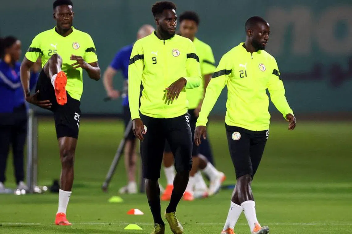 Soccer Football - FIFA World Cup Qatar 2022 - Senegal Training - Al Duhail SC 2, Doha, Qatar - December 3, 2022 Senegal's Boulaye Dia and Youssouf Sabaly during training REUTERS/Hannah Mckay/File Photo