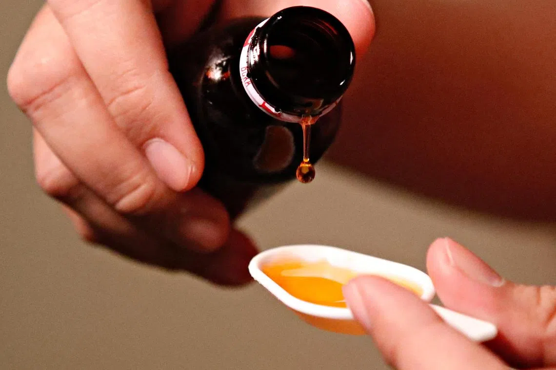 A dozen Indonesian families whose relatives died or were injured after consuming tainted cough syrups have sued the government and companies accused of supplying the products, according to a lawsuit.