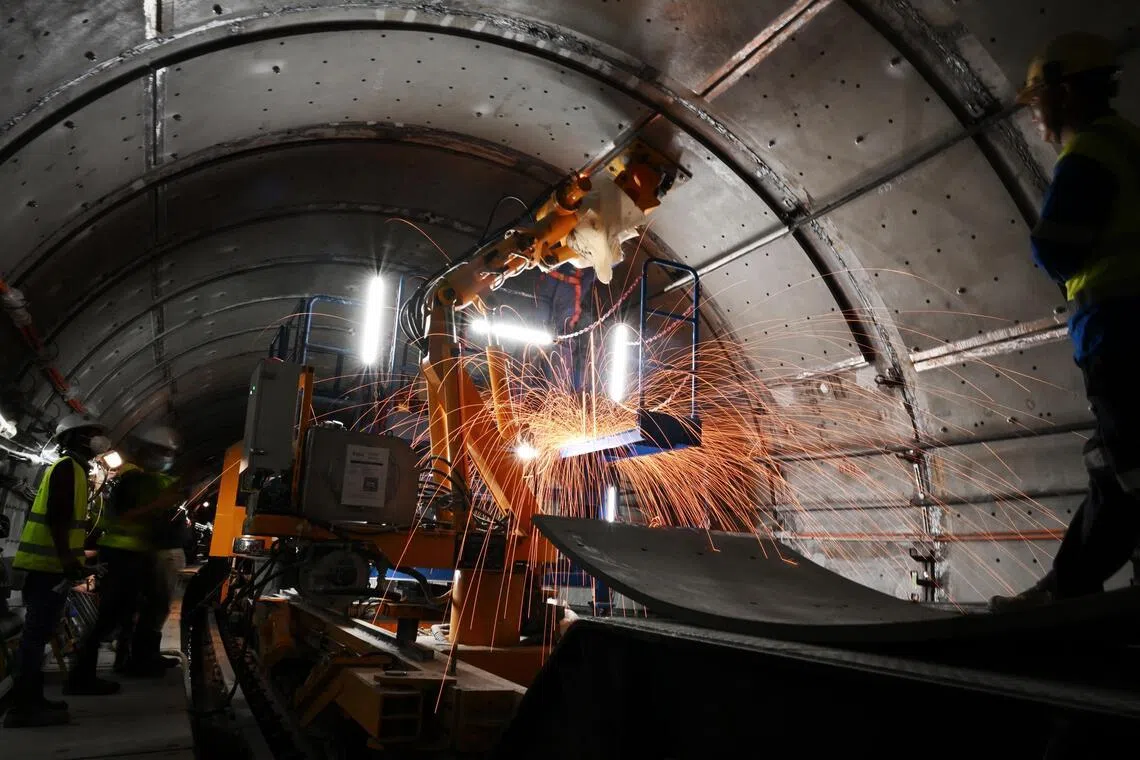 Electric and signalling cables had to be carefully shifted for the steel plates to be installed in the tunnels.