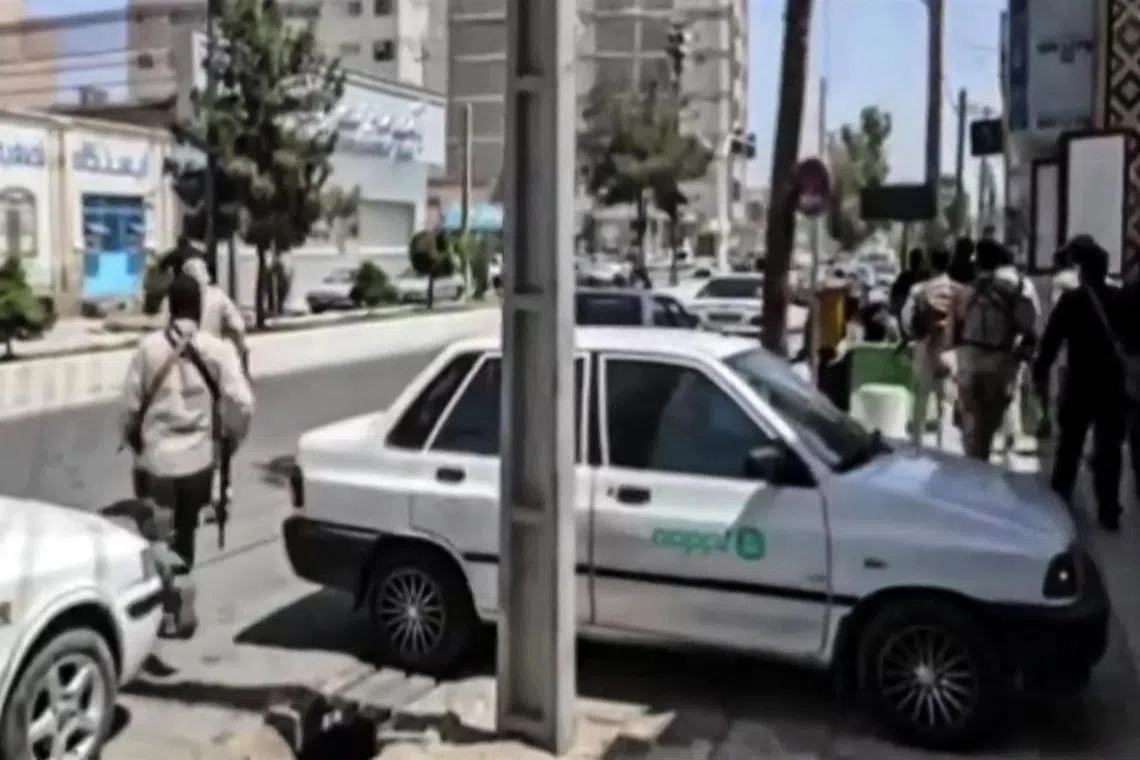 A video screengrab shows clashes in front of a judiciary building in Zahedan, the capital of southeastern Sistan-Baluchistan province. 