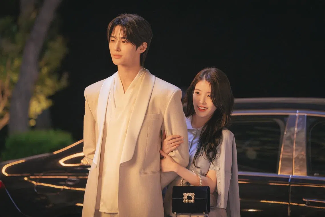 Byeon Woo-seok (left) and IU in Perfect Crown.