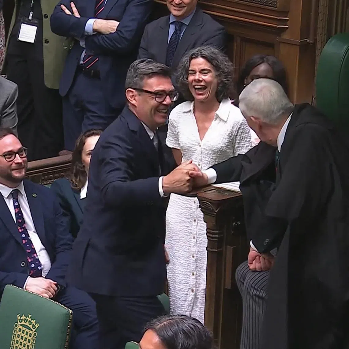Newly sworn-in Labour MP for Makerfield Andy Burnham shaking hands with Britain's Speaker of the House of Commons Lindsay Hoyle in Parliament in London on June 22.