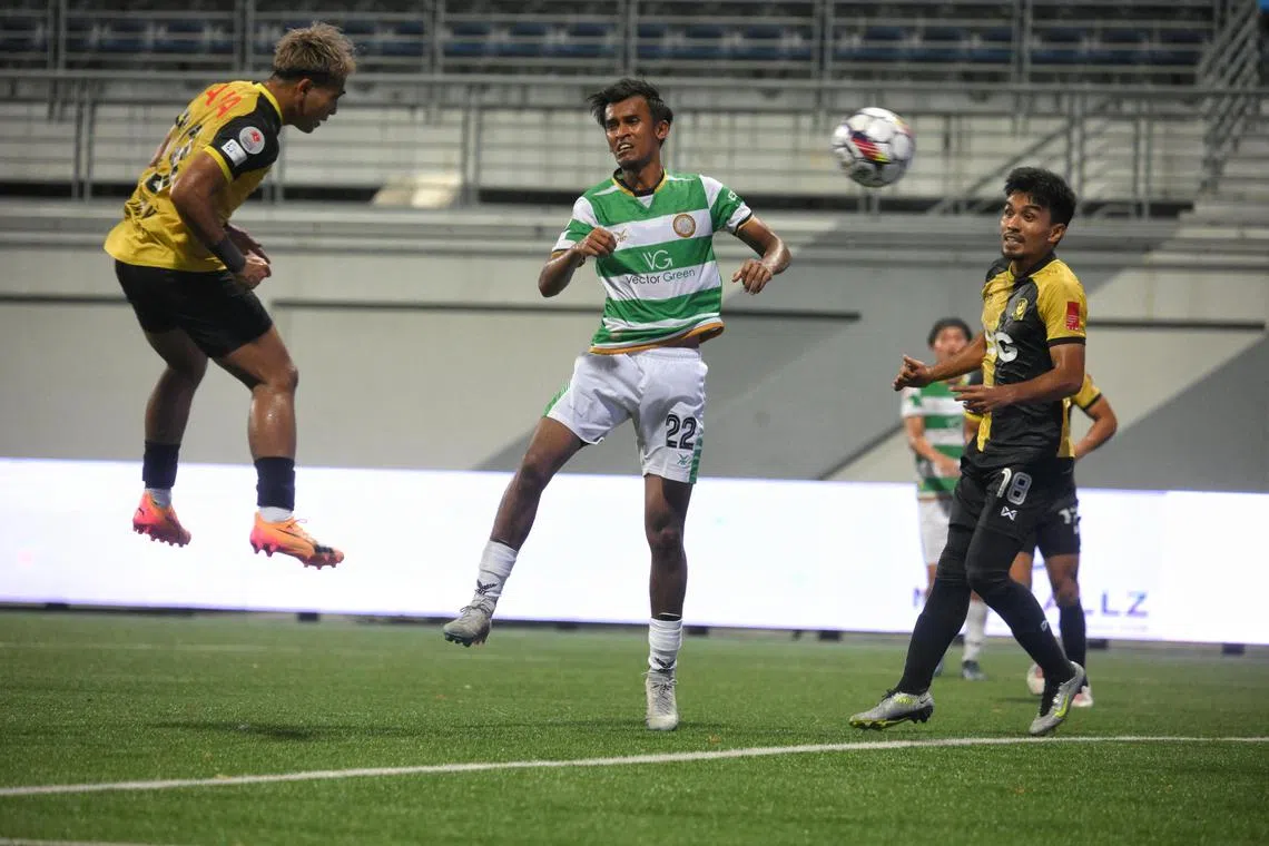 Taufik Suparno (left) heading home his second goal of the game and BG Tampines Rovers' equaliser. 