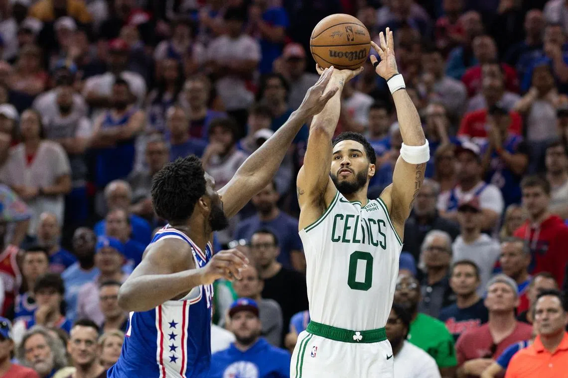 Boston Celtics forward Jayson Tatum shooting the ball past Philadelphia 76ers center Joel Embiid during the fourth quarter in game six of the 2023 NBA playoffs at Wells Fargo Centre.