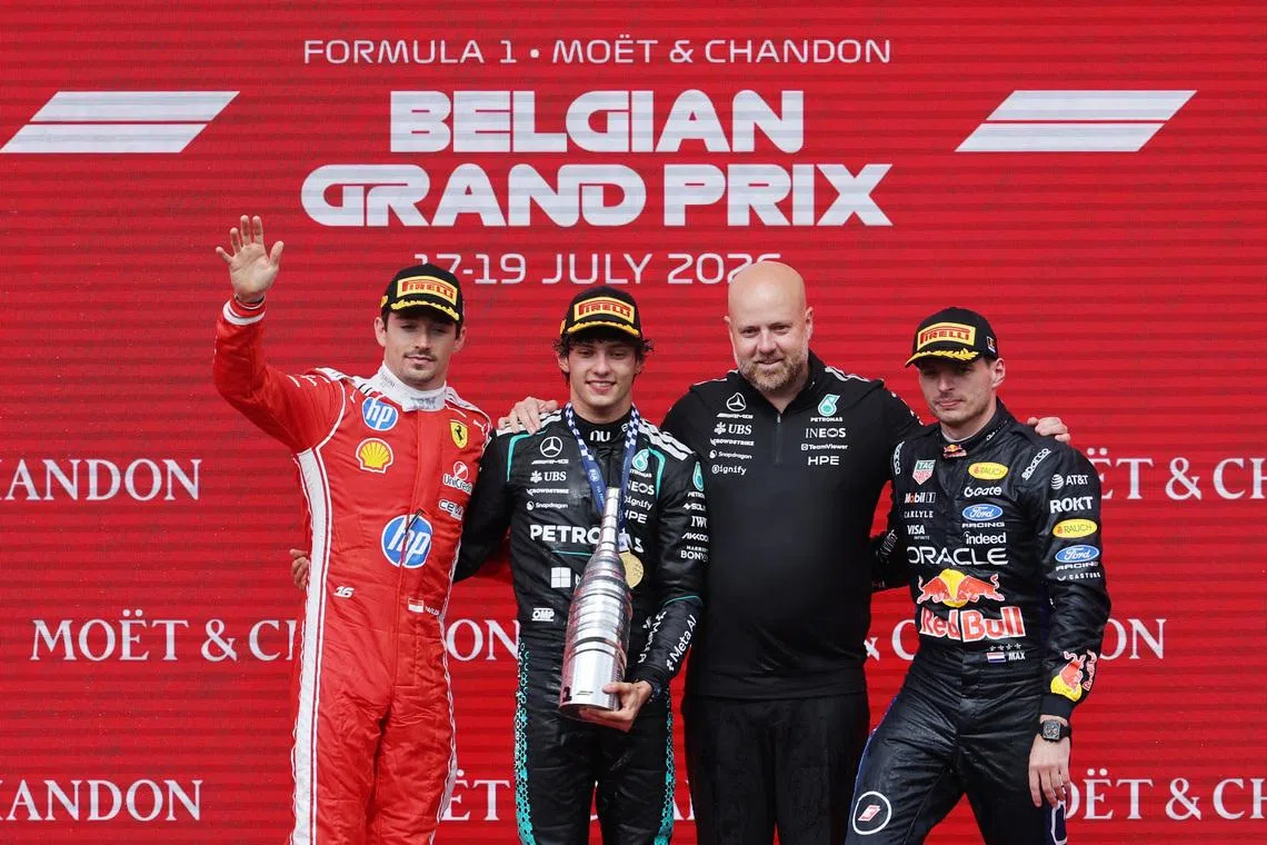Formula One F1 - Belgian Grand Prix - Circuit de Spa-Francorchamps, Stavelot, Belgium - July 19, 2026 Mercedes' Andrea Kimi Antonelli celebrates on the podium after winning the Belgian Grand Prix alongside second placed Ferrari's Charles Leclerc and third placed Red Bull's Max Verstappen REUTERS/Christian Hartmann