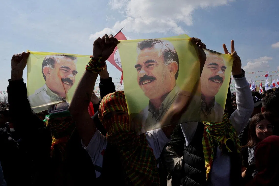 FILE PHOTO: Supporters of pro-Kurdish Peoples' Equality and Democracy Party (DEM Party) display flags with a portrait of jailed Kurdistan Workers Party (PKK) leader Abdullah Ocalan, during a rally to celebrate Nowruz, which marks the arrival of spring, in Istanbul, Turkey, March 17, 2024. REUTERS/Umit Bektas/File Photo