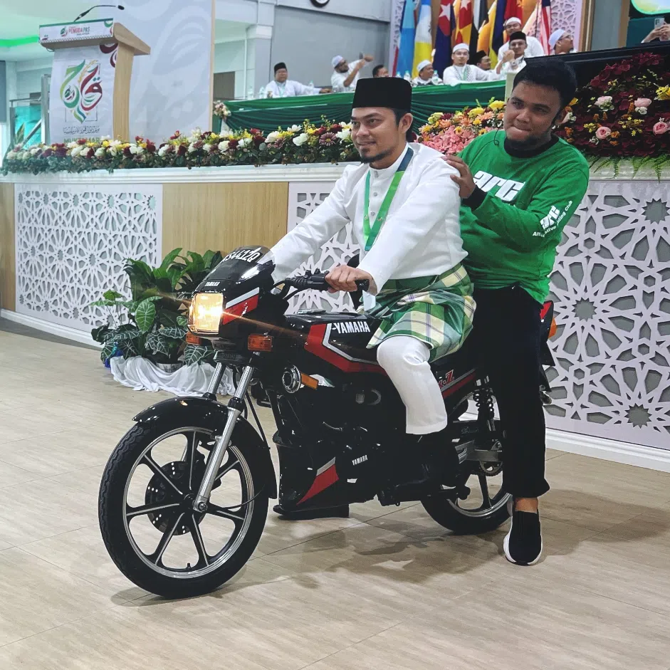 PAS youth wing chief Afnan Hamimi (left) and PAS youth wing's deputy chief Mohd Hafez Sabri on Yamaha RX-Z motorcycles at the opening ceremony of the wing's annual congress on Sept 12.
