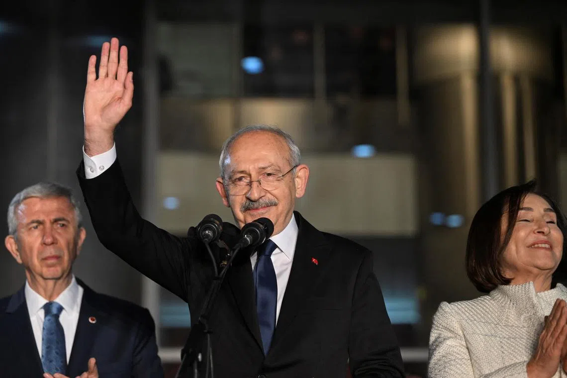 Turkey's main opposition Republican People's Party (CHP) leader Kemal Kilicdaroglu greets his supporters at the party's headquarters.
