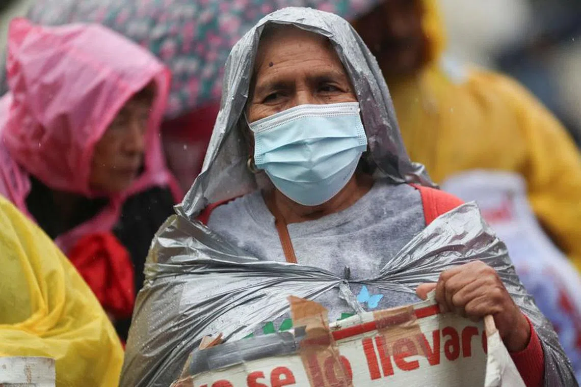 FILE PHOTO: A relative holds a banner with an image of a missing student from Ayotzinapa Teacher Training College during a march to demand justice for her loved ones, in Mexico City, Mexico July 26, 2023. REUTERS/Henry Romero/File Photo