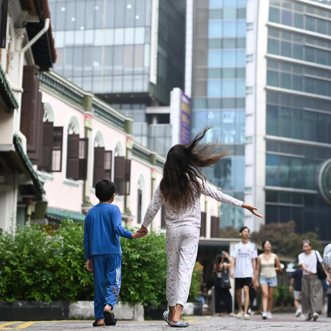 The children of Deborah Yeo, secretary of Emerald Hill Conservation Association, routinely walk to Orchard Road in their pyjamas, treating the global shopping street as part of their forever home.