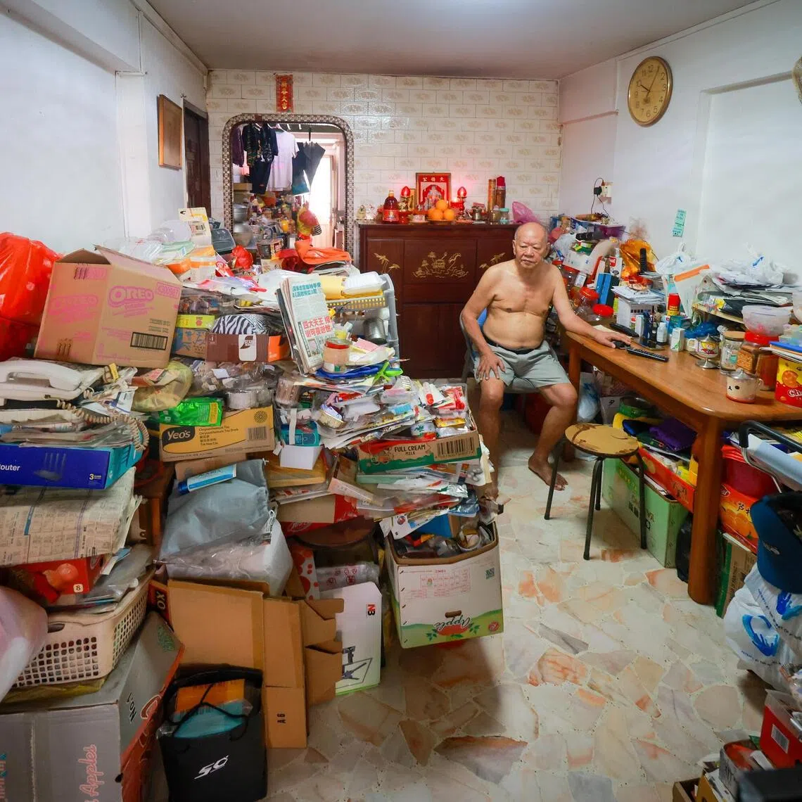 Ng Keng Leng in his clutter-filled unit on the ground floor of Block 39 Circuit Road on Aug 6.