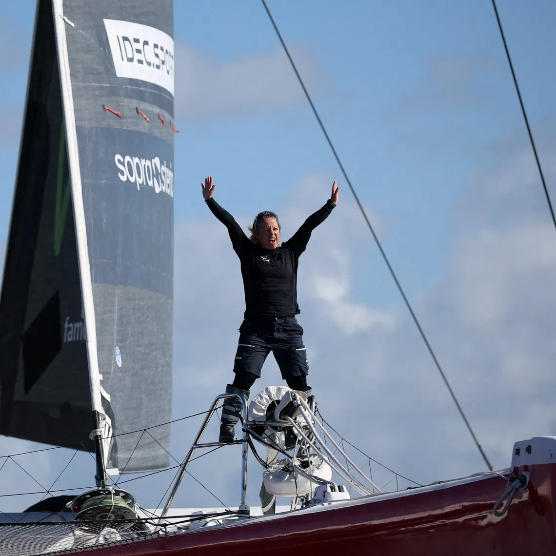 French skipper Alexia Barrier poses aboard her Ultim trimaran during a training sail off Brest, France, October 1, 2026, as she prepares to become the first woman to race an Ultim multihull, a 32-metre trimaran, in the Route du Rhum transatlantic race in November. REUTERS/Stephane Mahe