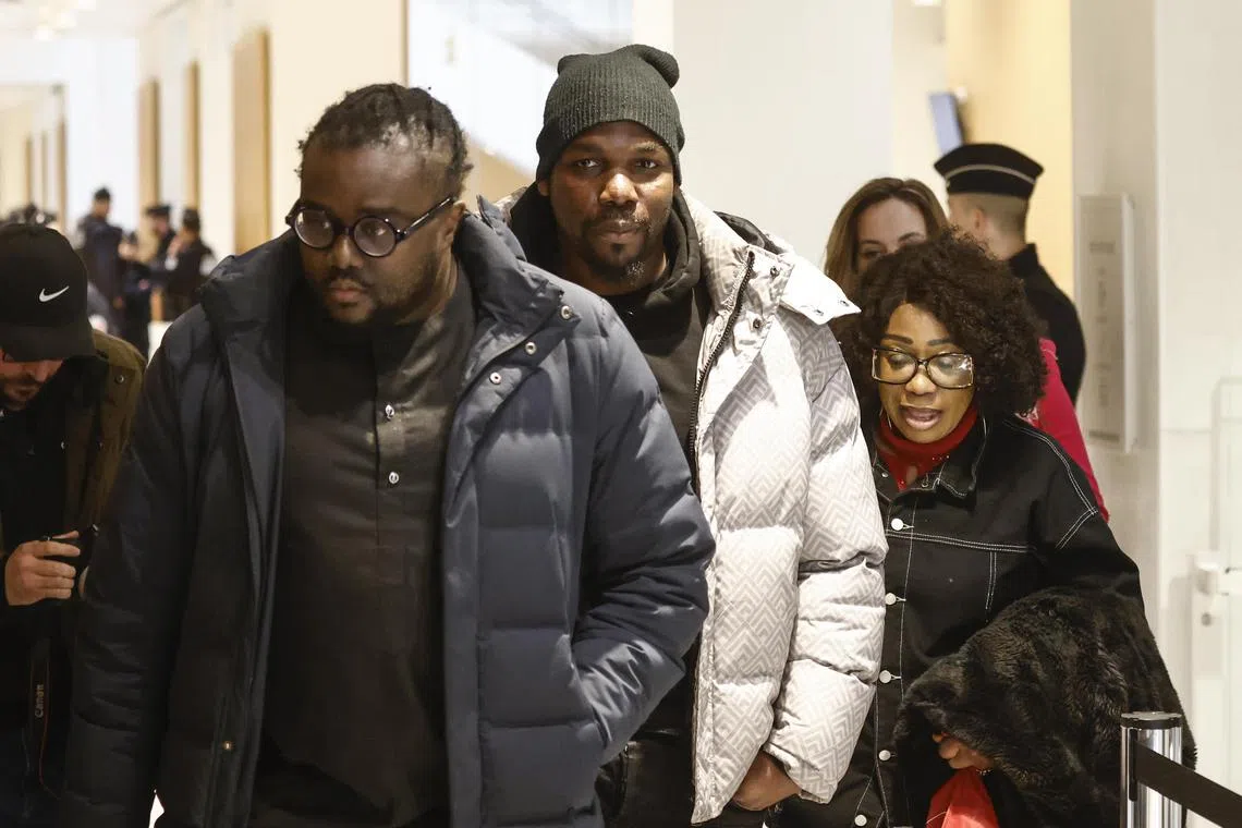epa11785589 Mathias Pogba, brother of French soccer player Paul Pogba (C), arrives with his lawyer, Tabula Mbeko (L), for his trial at the courthouse in Paris, France, 19 December 2024. Six men, including Mathias Pogba, the brother of French midfielder Paul Pogba, are on trial on charges of attempted extortion of millions of euros and threatening former Juventus player Paul Pogba with a gun in 2022.  EPA-EFE/YOAN VALAT