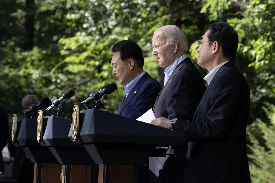 (From left) South Korean President Yoon Suk-yeol, US President Joe Biden and Japanese Prime Minister Fumio Kishida in Camp David, Maryland on Aug 18.