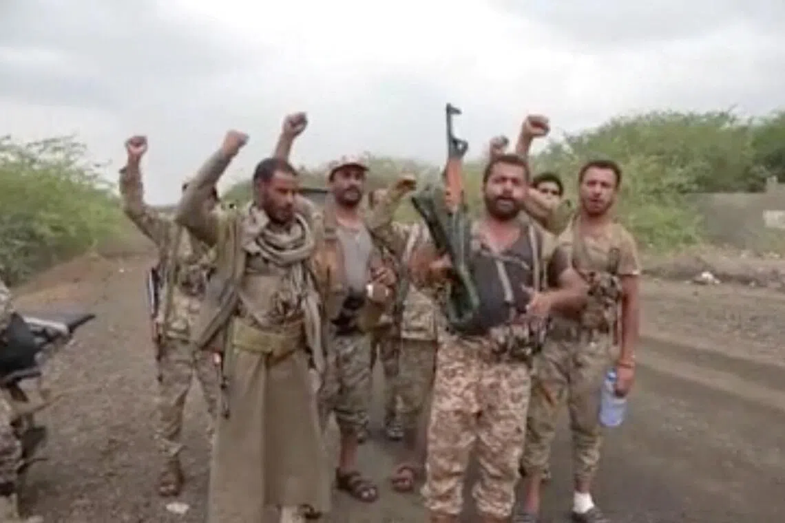A screengrab from video shows men gesturing after Houthis captured the city of Mokha in Yemen’s Taiz Province.