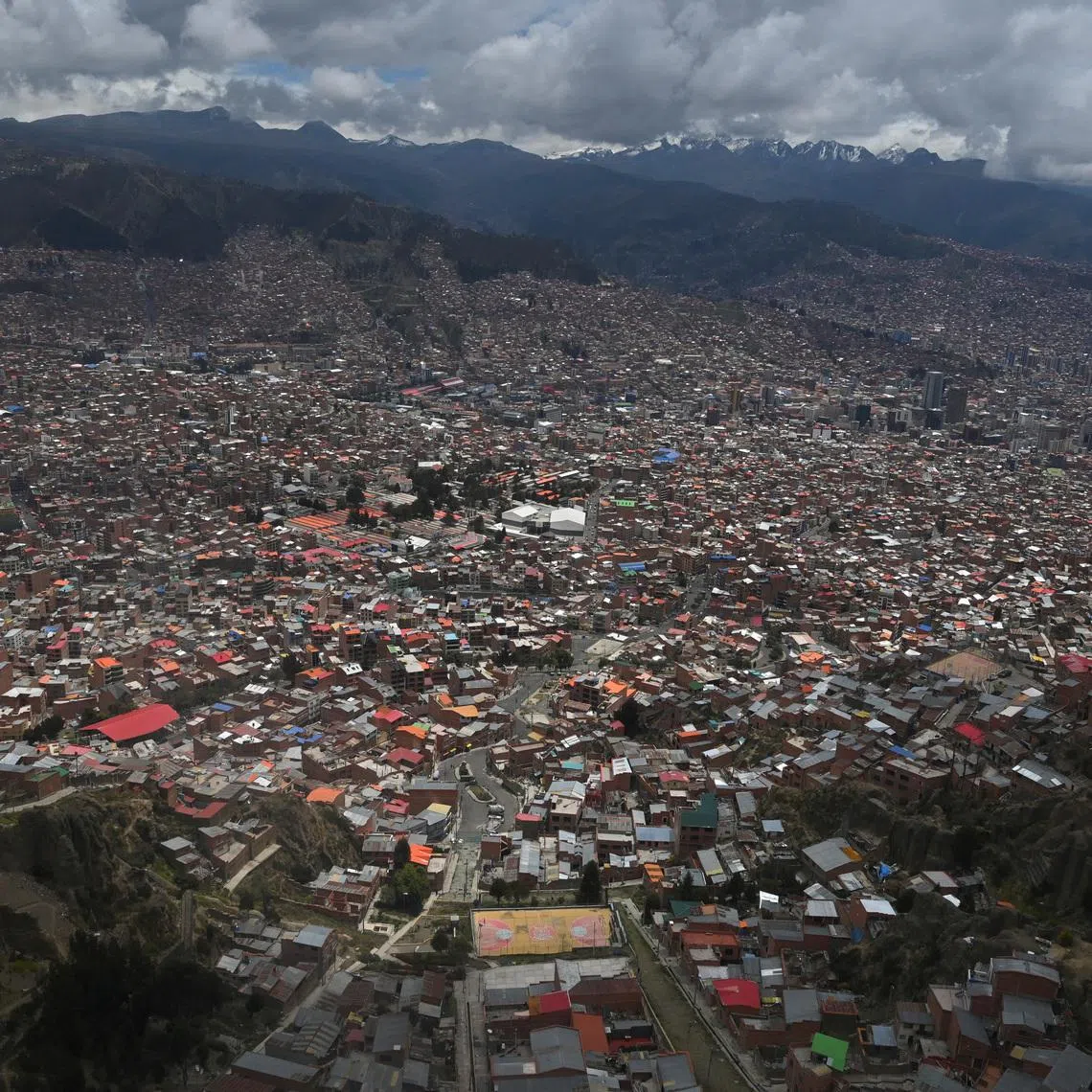 A view, taken through a window, shows the city of La Paz as the government discusses stabilizing the energy sector amid declining production and economic pressures, in El Alto, Bolivia, January 15, 2026. REUTERS/Claudia Morales/File Photo