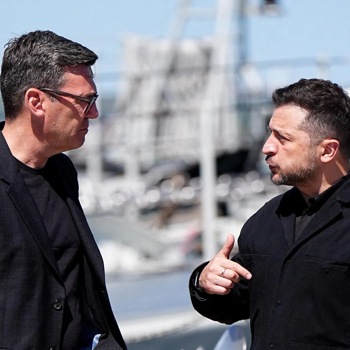 British Prime Minister Andy Burnham (left) speaks with Ukrainian President Volodymyr Zelensky at HM Naval Base in Portsmouth, Hampshire, on July 27.