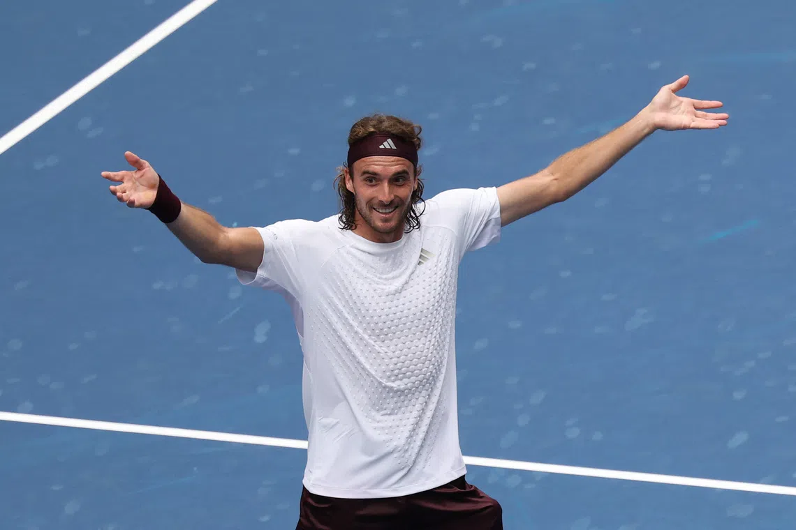 Stefanos Tsitsipas celebrates after winning his first round match against Arthur Fils.