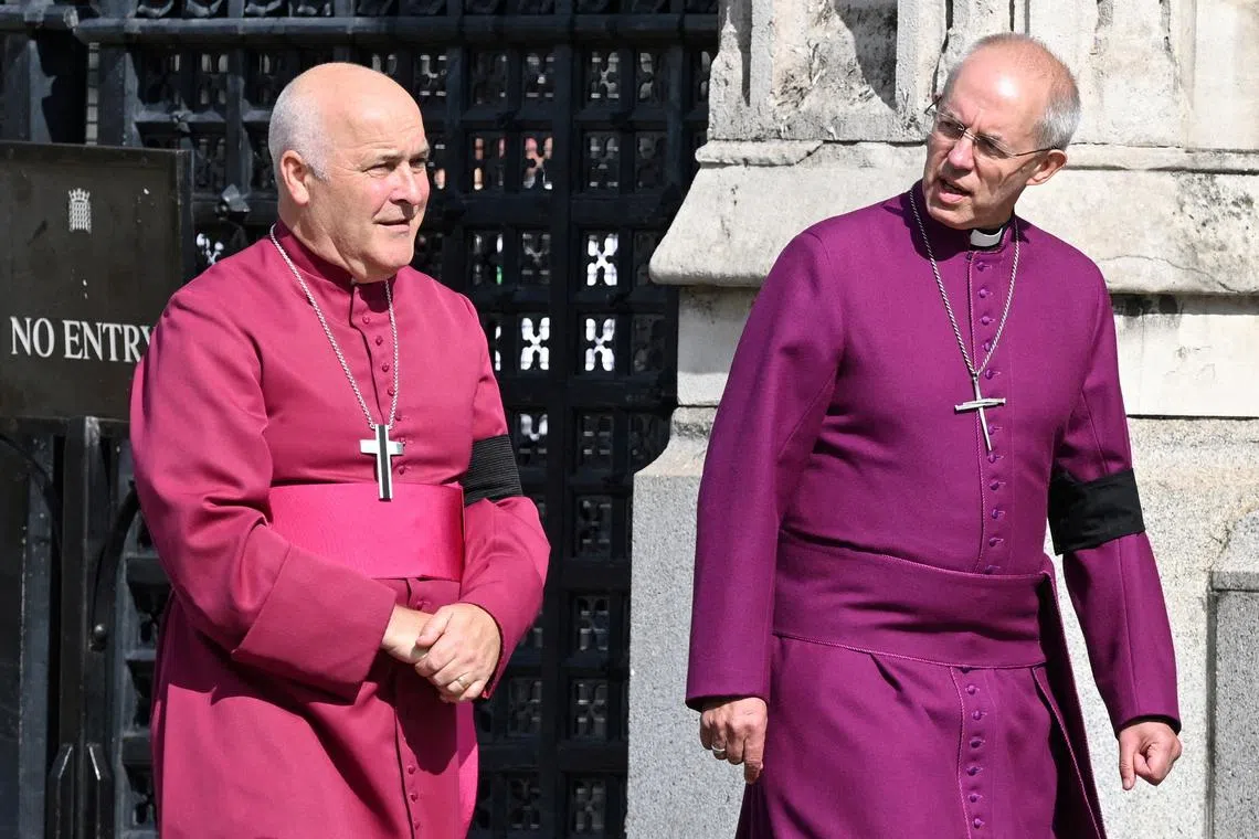 FILE PHOTO: Archbishop of York Stephen Geoffrey Cottrell (L) and The Archbishop of Canterbury Justin Welby walk in central London on September 14, 2022. JUSTIN TALLIS/Pool via REUTERS/File Photo