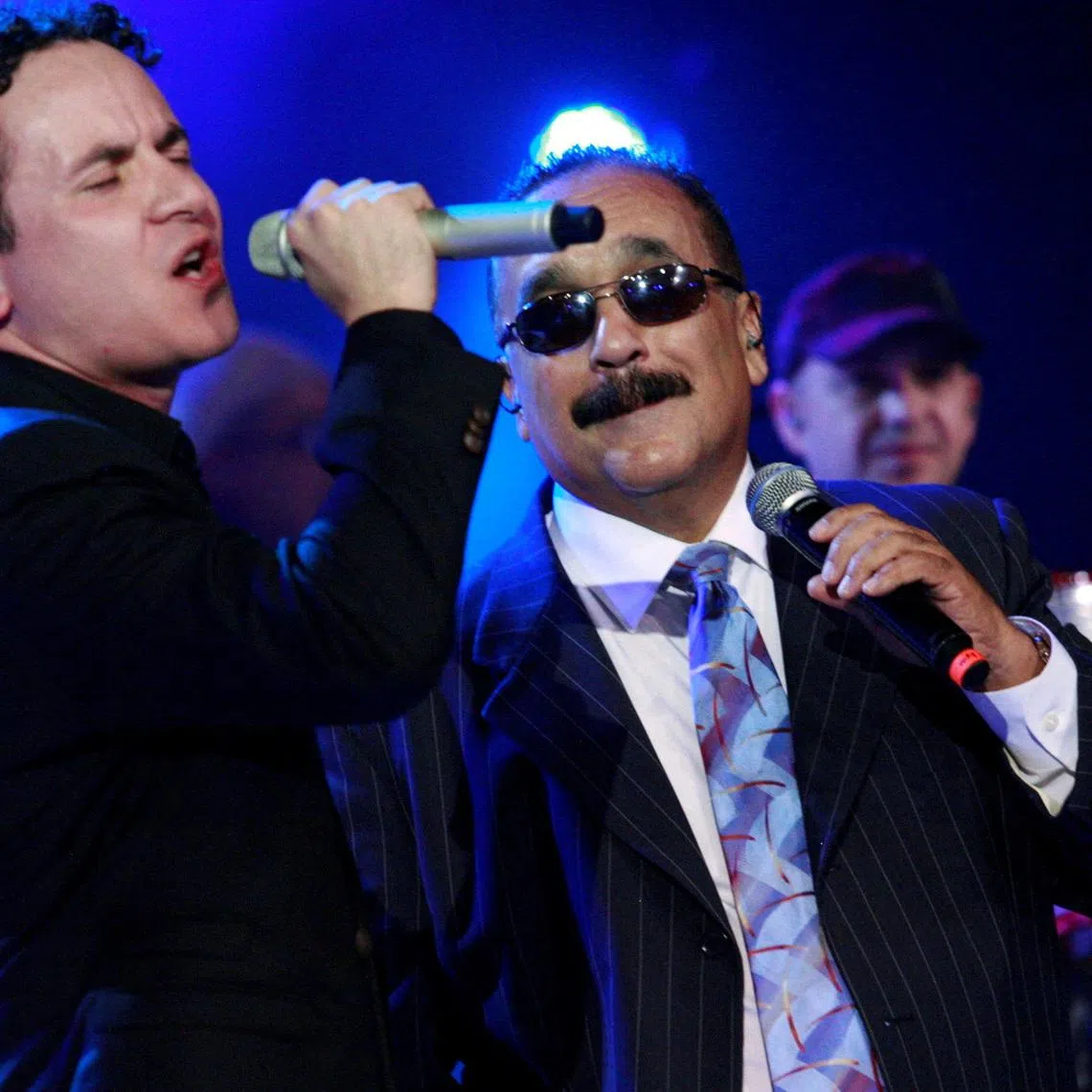 FILE PHOTO: Singer Fonseca (L) and trombonist Willie Colon perform during the Miss Colombia 2010 in Cartagena November 15, 2010. REUTERS/Jairo Castilla/File Photo