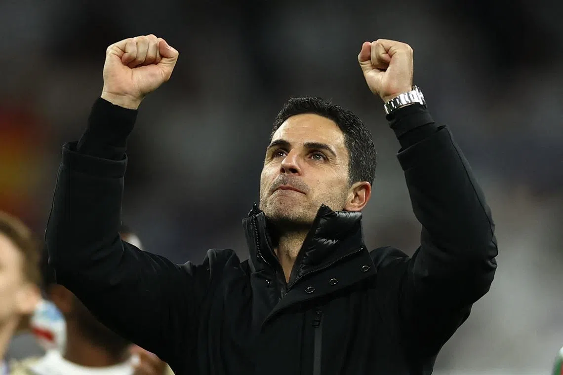 Soccer Football - Champions League - Quarter Final - Second Leg - Real Madrid v Arsenal - Santiago Bernabeu, Madrid, Spain - April 16, 2025 Arsenal manager Mikel Arteta celebrates after the match Action Images via Reuters/Lee Smith