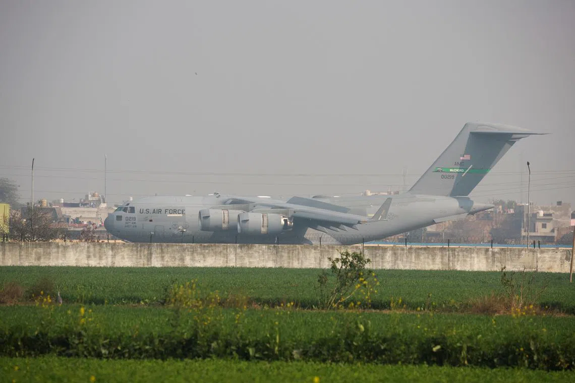 A U.S. military plane deporting illegal Indian immigrants lands in Amritsar, India February 5, 2025. REUTERS/Adnan Abidi