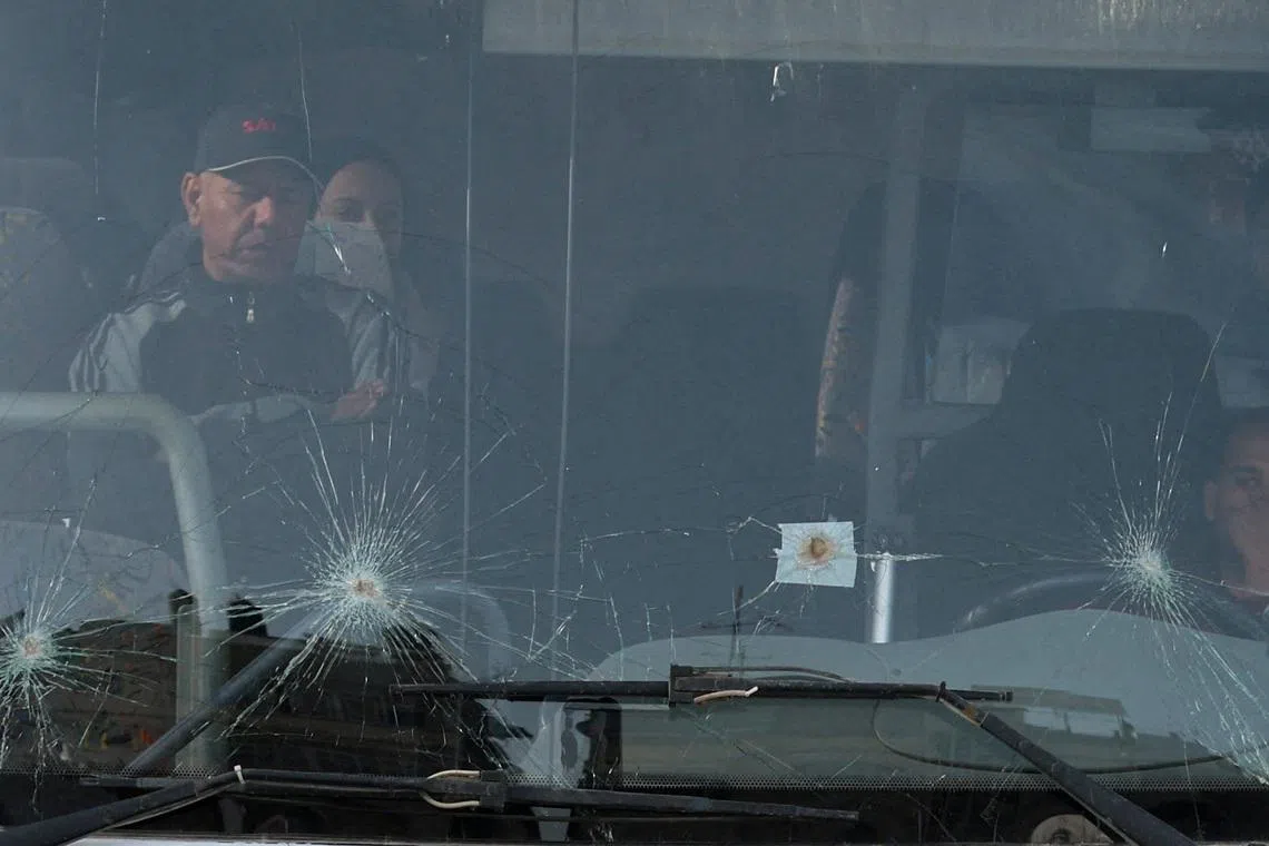 Palestinians sit in a bus as they get ready to leave Gaza through the Rafah border crossing between Gaza and Egypt after it was opened by Israel on Thursday for a limited number of people, in Khan Younis in the southern Gaza Strip, March 19, 2026. REUTERS/Ramadan Abed      TPX IMAGES OF THE DAY