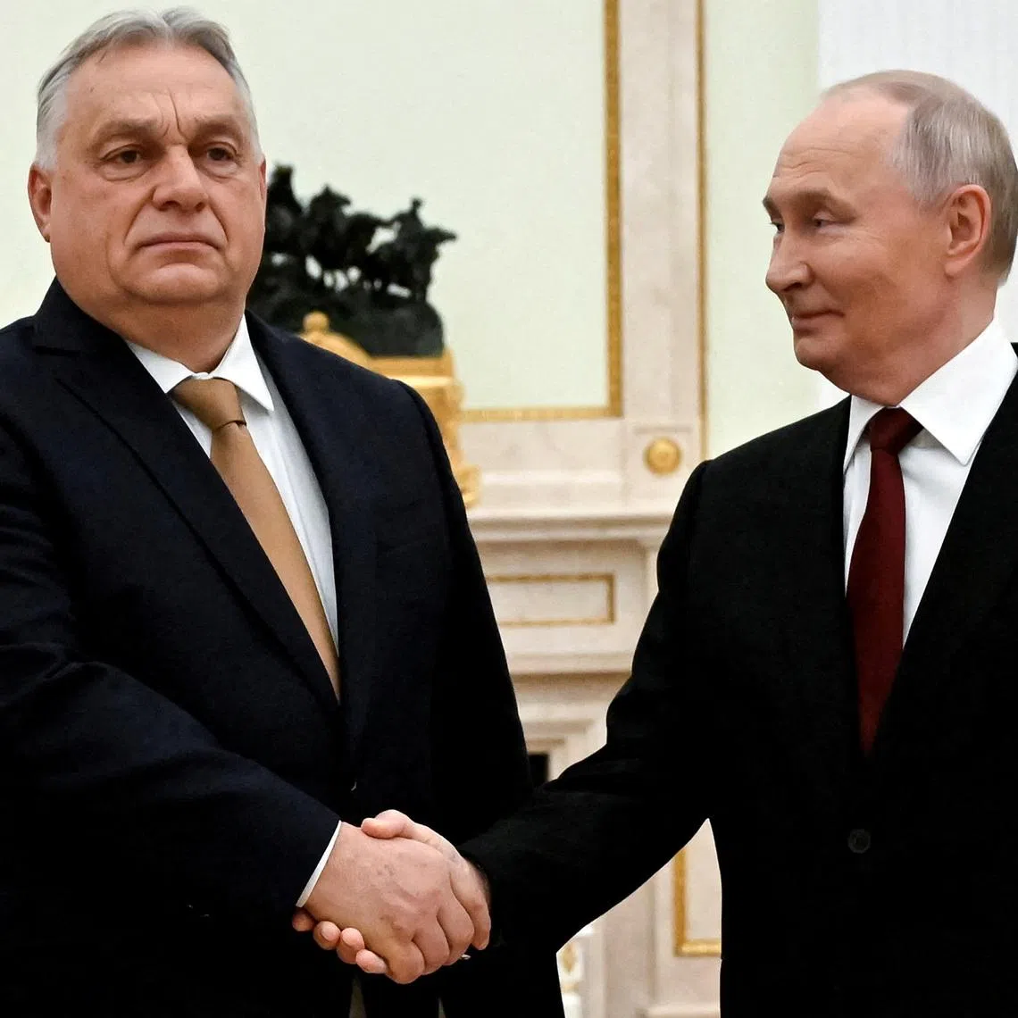 FILE PHOTO: Russian President Vladimir Putin shakes hands with Hungarian Prime Minister Viktor Orban during a meeting in Moscow, Russia, November 28, 2025. Alexander Nemenov/Pool via REUTERS/File Photo