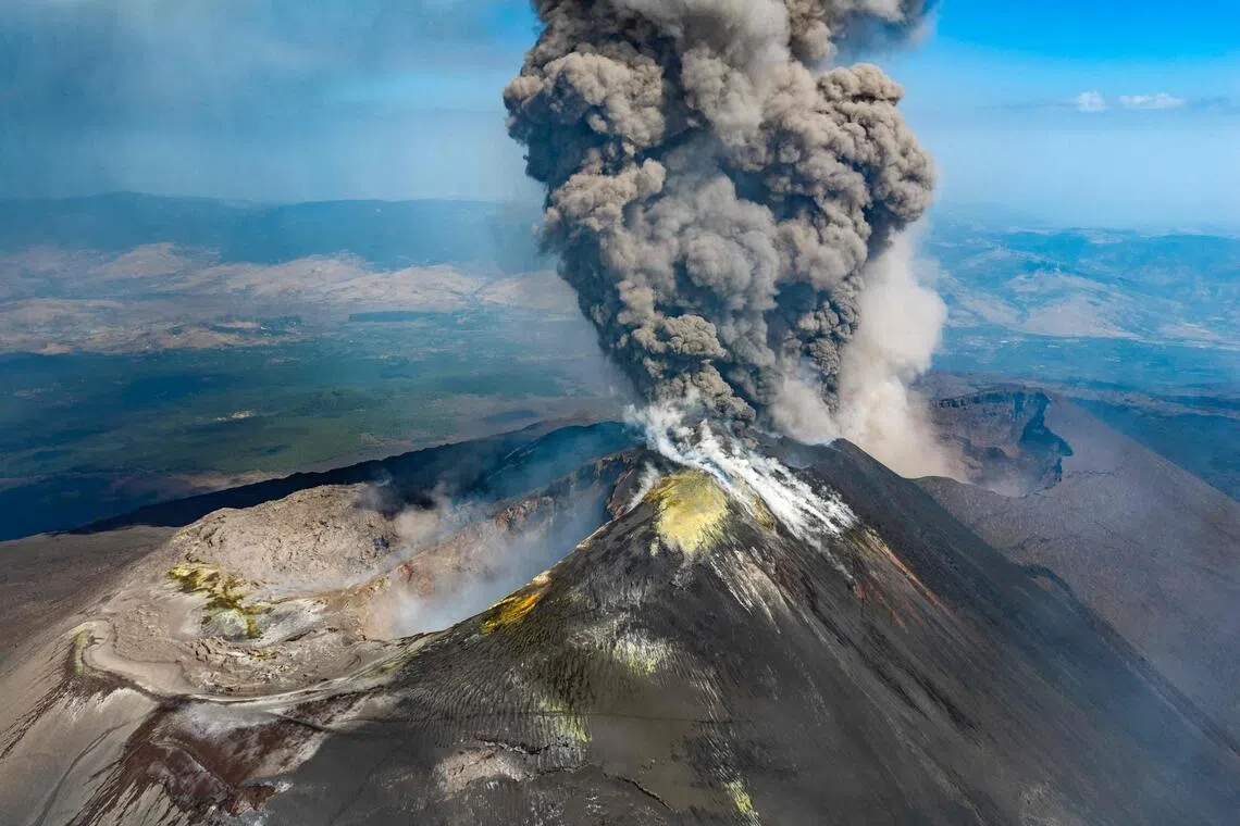 A plume of ash rising from Mount Etna during an eruption on July 30.