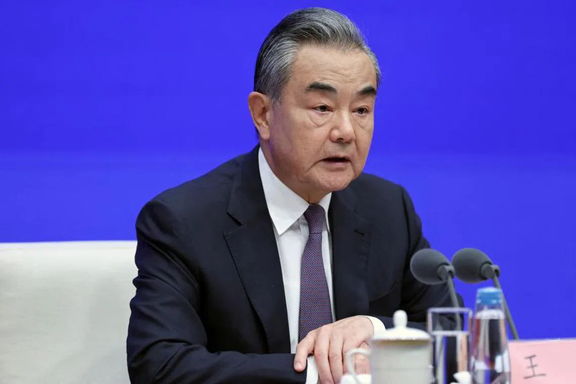 FILE PHOTO: Chinese Foreign Minister Wang Yi attends a press conference on the white paper on \"A Global Community of Shared Future: China's Proposals and Actions\", in Beijing, China September 26, 2023. REUTERS/Shubing Wang/File photo