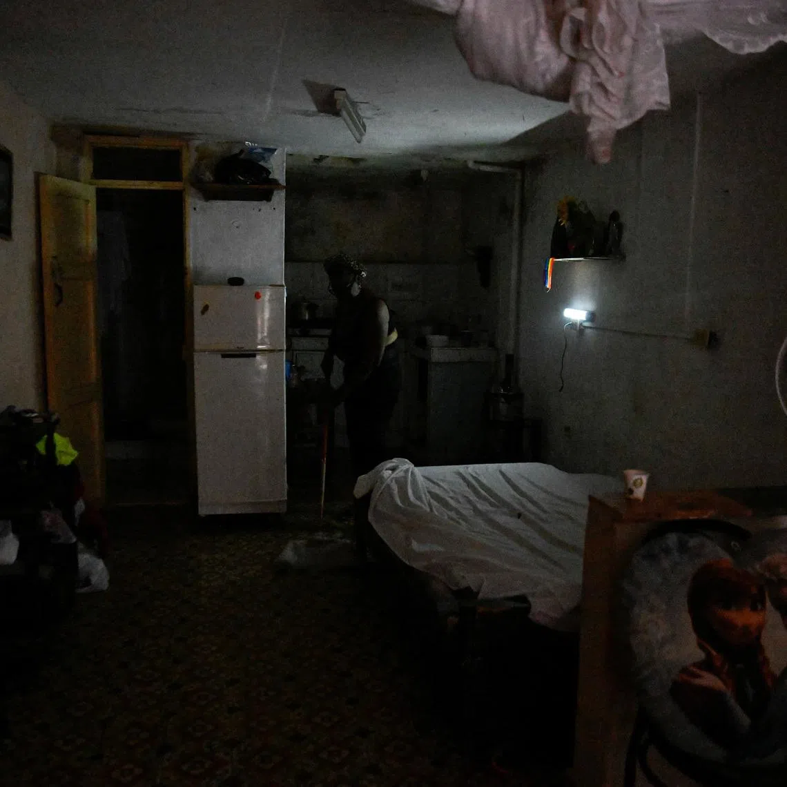 Moraima Ricardo, 62, a retired human resources professional, cleans her home during a mass blackout across most of the country, in Havana, Cuba March 4, 2026. REUTERS/Norlys Perez
