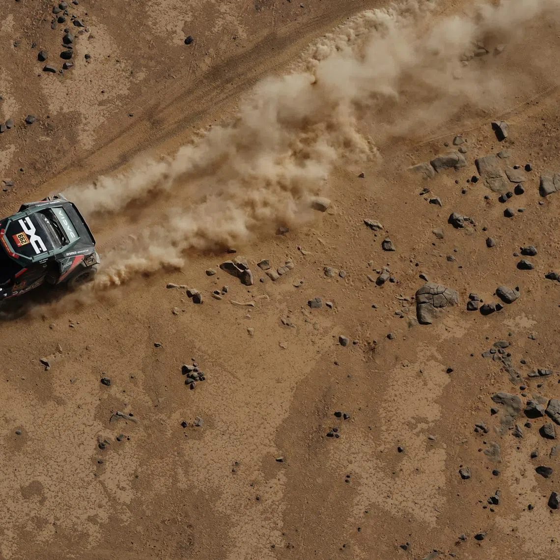 Rallying - Dakar Rally - Stage 11 - Bisha to Al Henakiyah - Bisha, Saudi Arabia - January 15, 2026 Dacia's Nasser Al-Attiyah and Fabian Lurquin in action during stage 11. REUTERS/Stephane Mahe