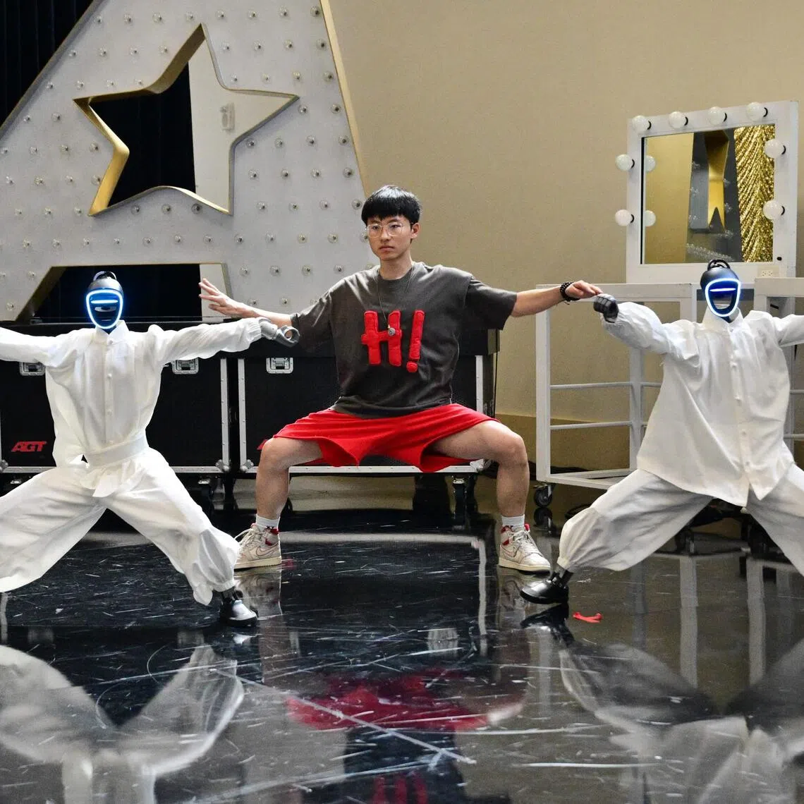 Chinese street dancer Wu Yufei performs alongside Unitree humanoid robots in Pasadena, California ahead of their performance in the Season 21 finals of America’s Got Talent on Sept 22.
