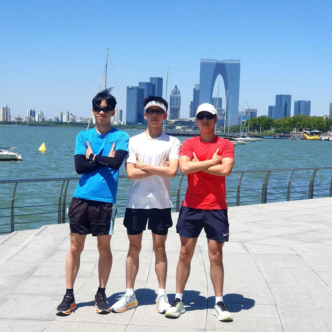 (From left) Jensen Jing, Ryan Tay, and Timothy Foo, who raised $44,500 for cancer research in a 10-day relay run through China. 
