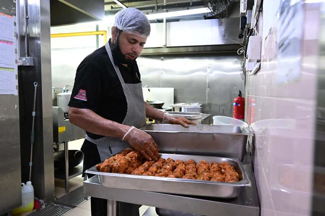 Tiffin meals being prepared at Dabba Junction’s central kitchen in Kampong Ampat.