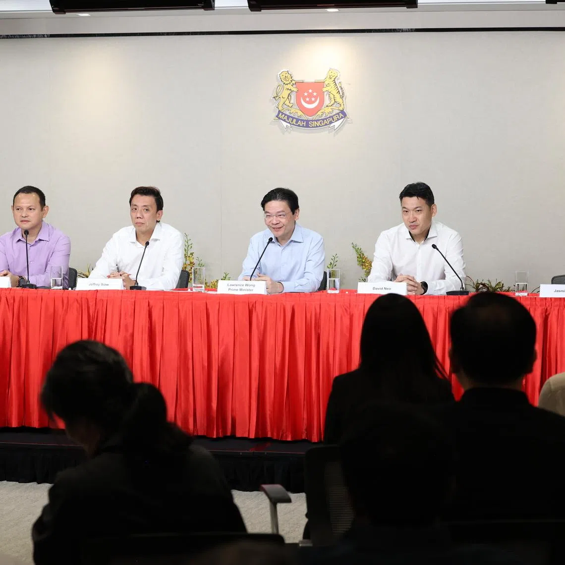 Prime Minister Lawrence Wong (fourth from left) announcing a Cabinet reshuffle at a press conference on July 22. With him are (from left) Goh Pei Ming, Zaqy Mohamad, Jeffrey Siow, David Neo and Jasmin Lau.