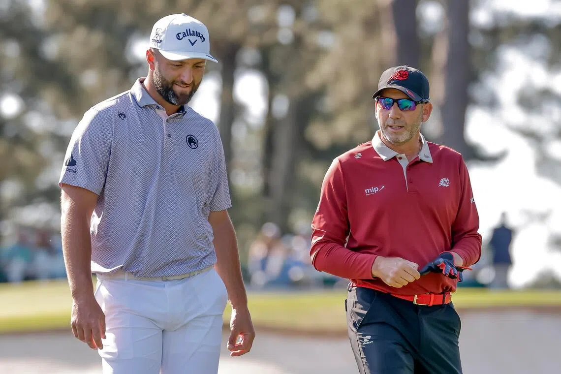 Jon Rahm (left) and Sergio Garcia walk off the tee on the third hole during the final round of the 2026 Masters Tournament at the Augusta National Golf Club.