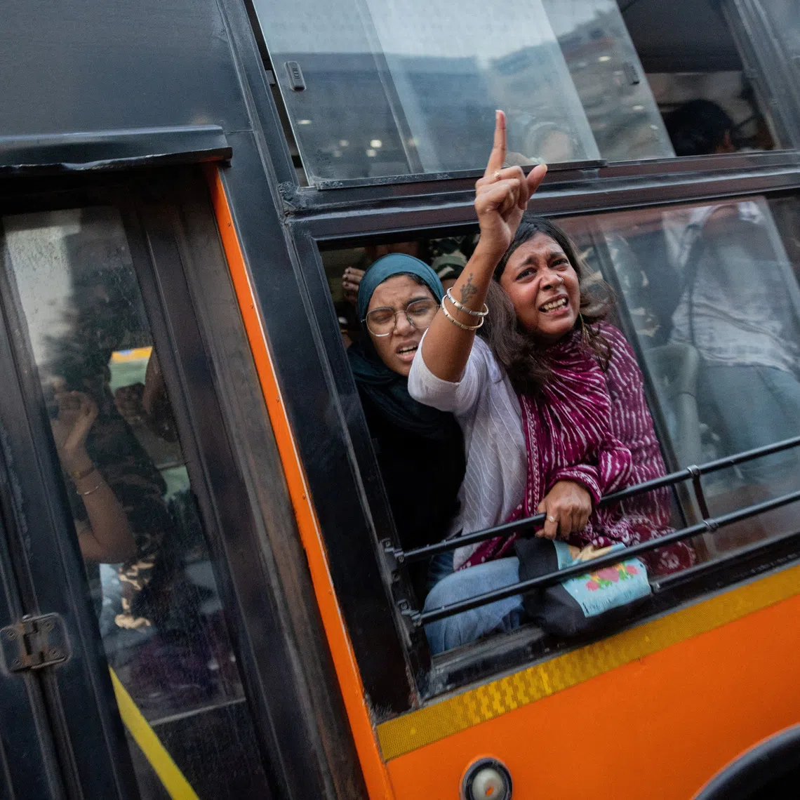 Protestors shout slogans from a police bus after being detained during a flag rally seeking the resignation of India's Chief Election Commissioner Gyanesh Kumar, in New Delhi, India, October 16, 2026. REUTERS/Adnan Abidi