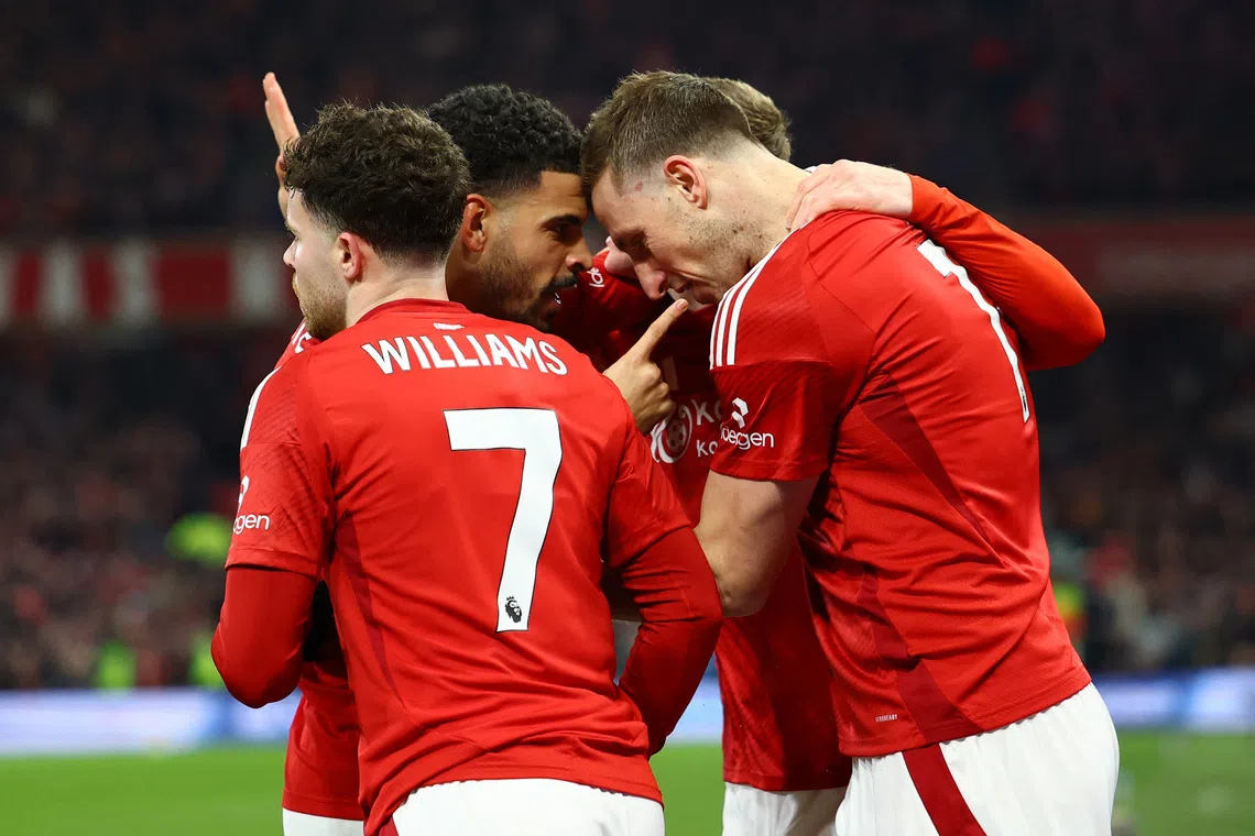 Soccer Football - Premier League - Nottingham Forest v Liverpool - The City Ground, Nottingham, Britain - January 14, 2025 Nottingham Forest's Chris Wood celebrates scoring their first goal with Nottingham Forest's Neco Williams and Nottingham Forest's Morgan Gibbs-White Action Images via Reuters/Andrew Boyers