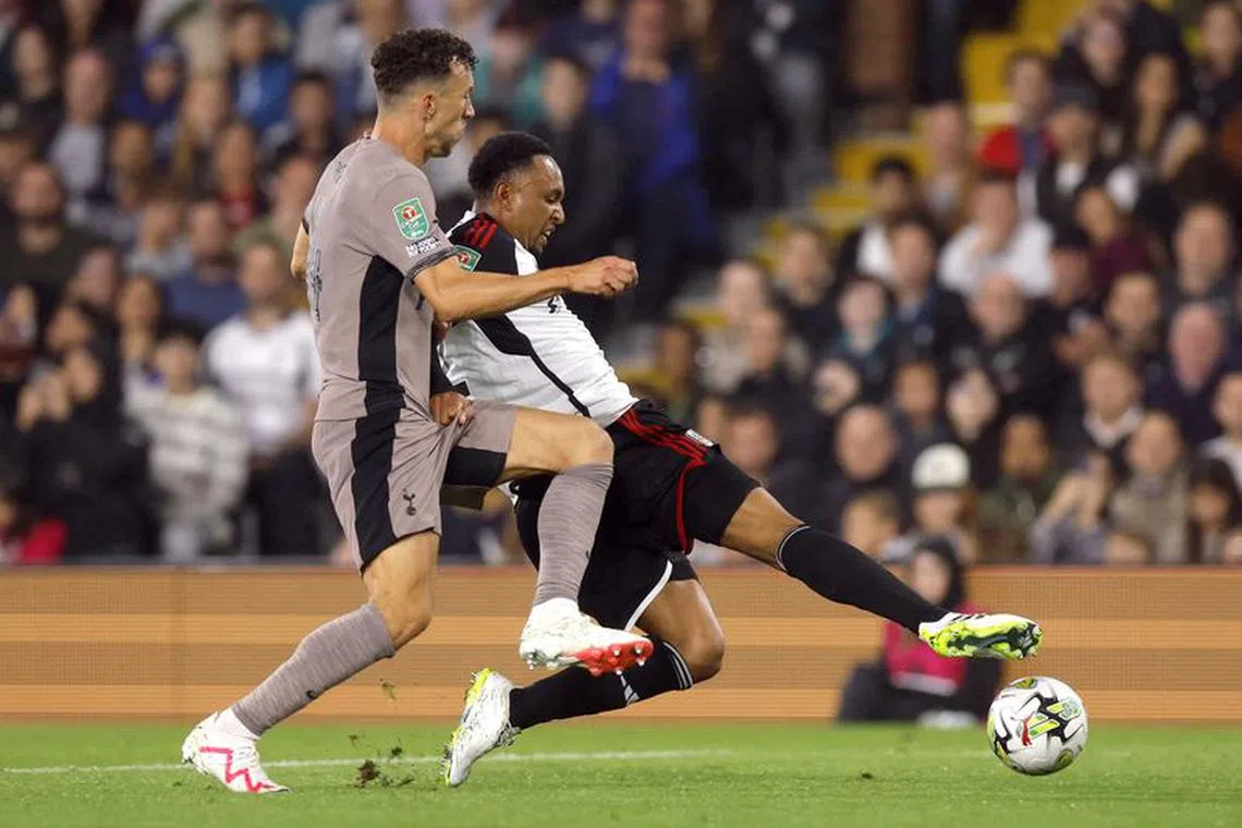 Soccer Football - Carabao Cup Second Round - Fulham v Tottenham Hotspur - Craven Cottage, London, Britain - August 29, 2023 Tottenham Hotspur's Ivan Perisic in action with Fulham's Kenny Tete Action Images via Reuters/Andrew Couldridge