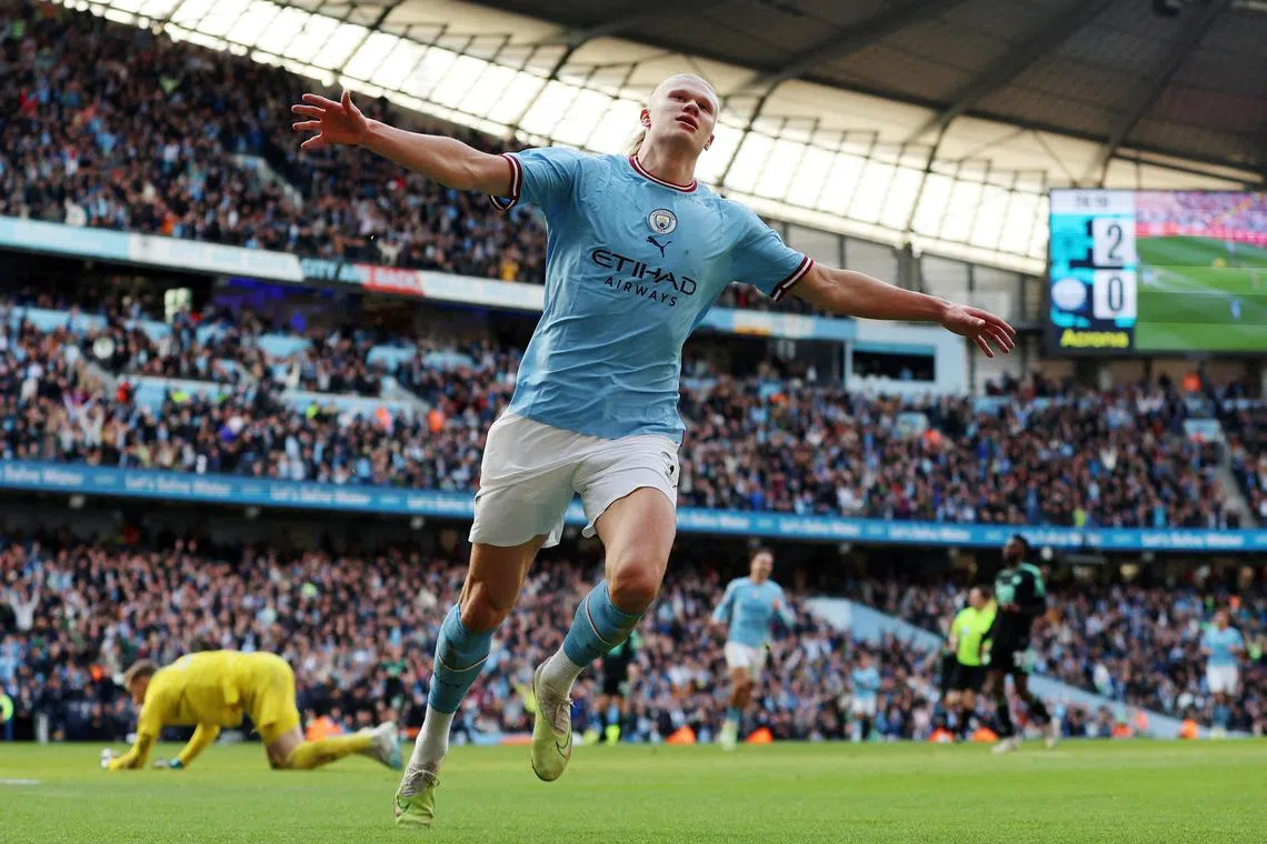 Manchester City striker Erling Haaland celebrates after scoring the team's third goal in the 3-1 win over Leicester City.