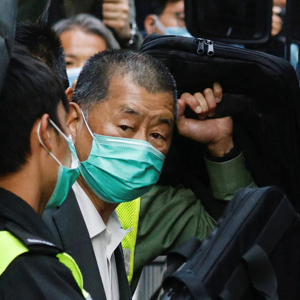 Media tycoon Jimmy Lai, founder of Apple Daily, looks on as he leaves the Court of Final Appeal by prison van, in Hong Kong, China February 1, 2021. REUTERS/Tyrone Siu