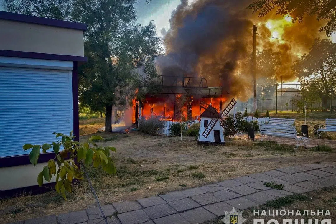 A view shows a burning children's cafe hit by a Russian military strike, amid Russia's attack on Ukraine, in the village of Malokaterynivka, Zaporizhzhia region, Ukraine August 20, 2024. National Police/Handout via REUTERS