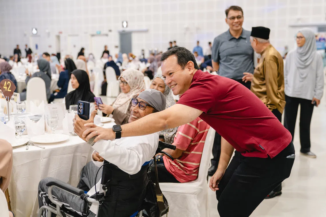 Acting Minister-in-Charge of Muslim Affairs, Zaqy Mohamad engaging with seniors at the MUIS Zakat Beneficiaries Seniors Day 2026 on Sept 3.